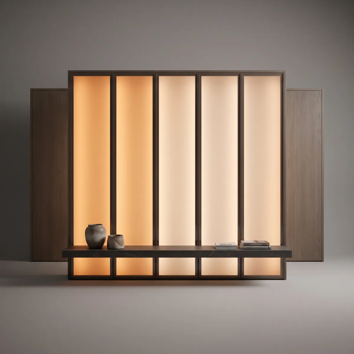 A walnut wall of five bronze-framed backlit panels, amber to white, behind a floating black marble bench