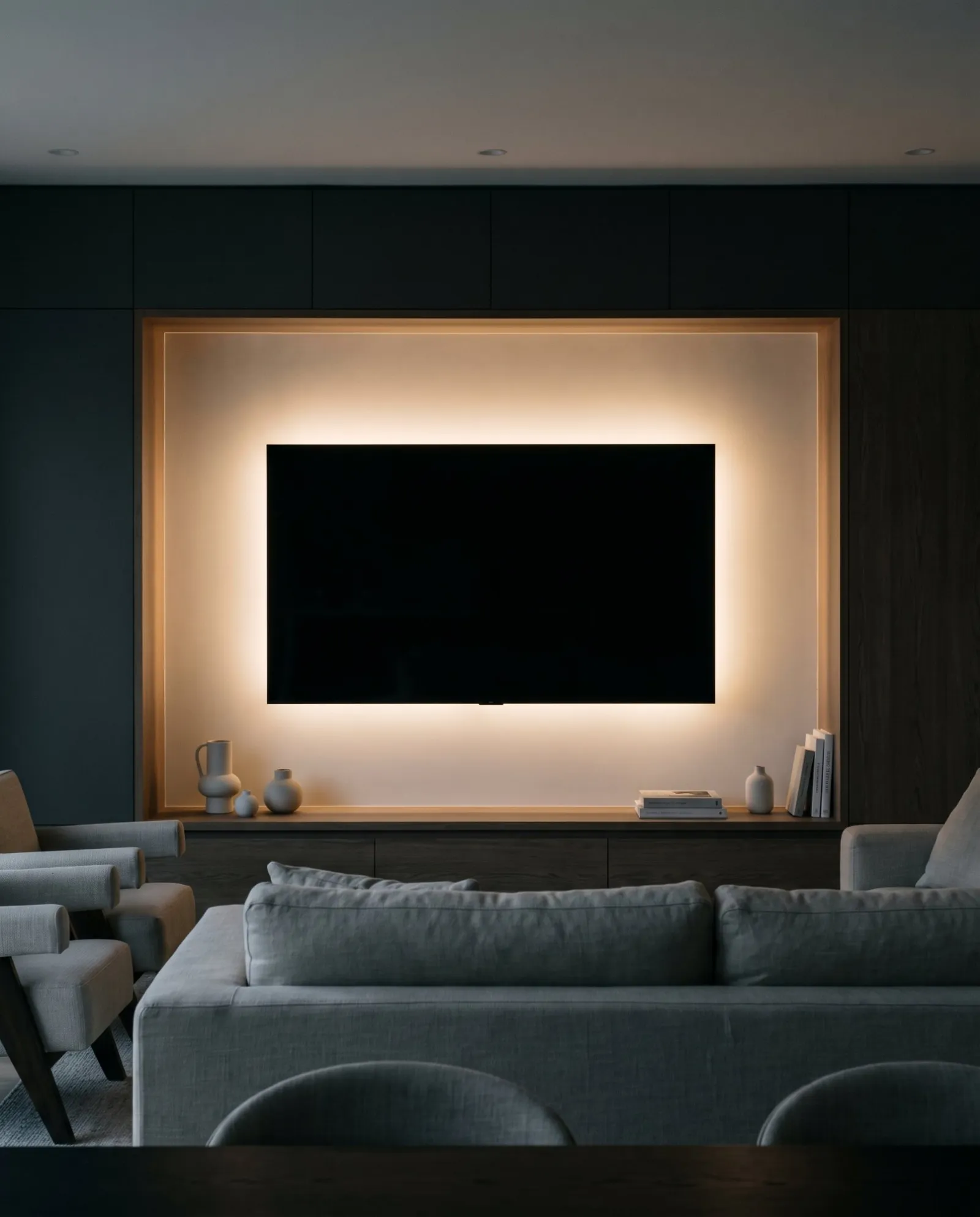 A screen in a niche with a soft halo of light